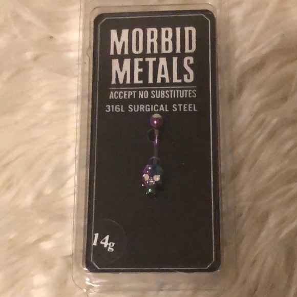 Hot Topic Jewelry - Oil slick skull belly ring